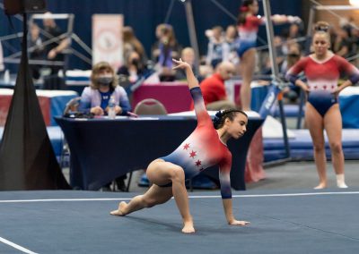 Team gymnast posing on floor