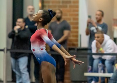 Team gymnast posing on floor